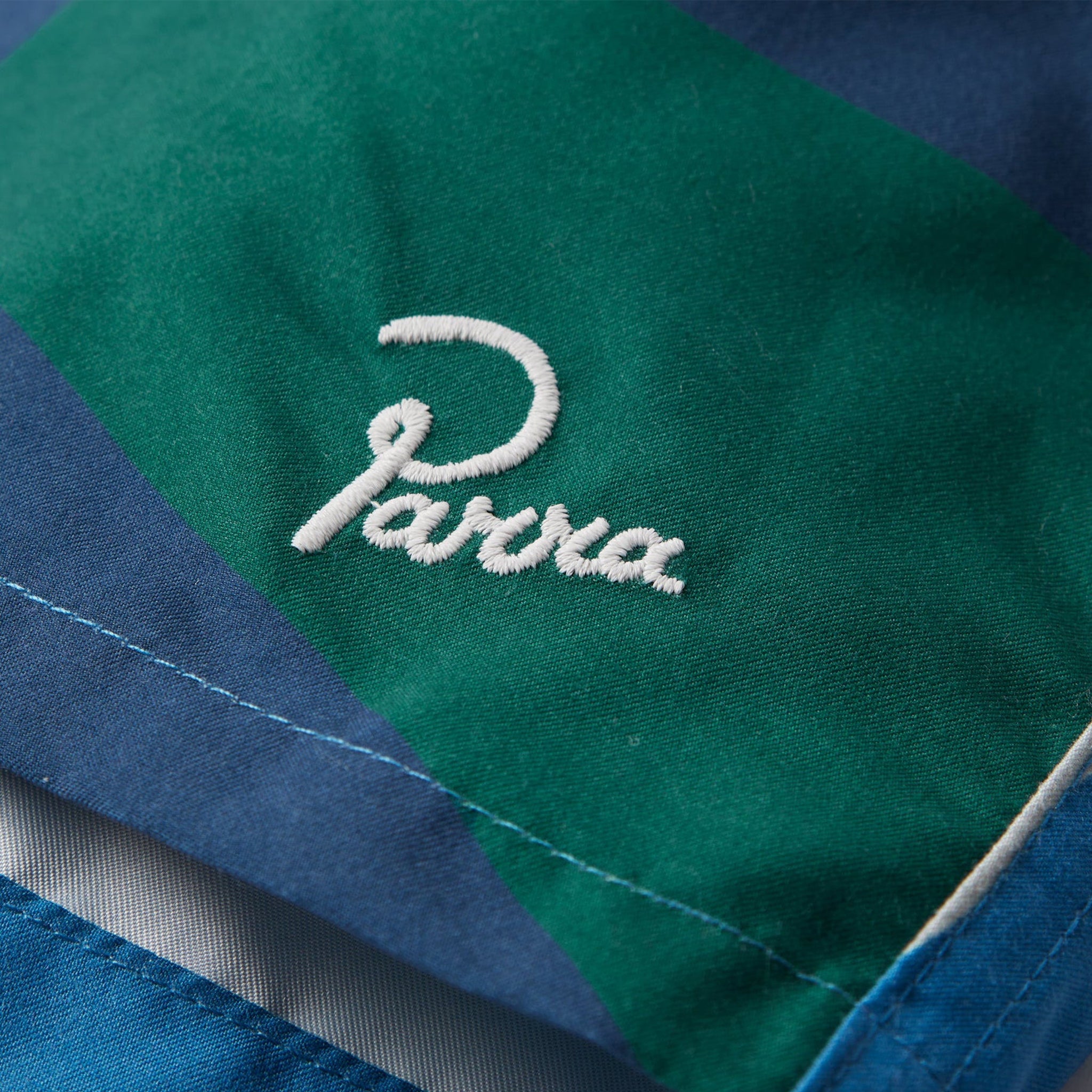 THE FESTIVAL FENCE SWIM SHORTS